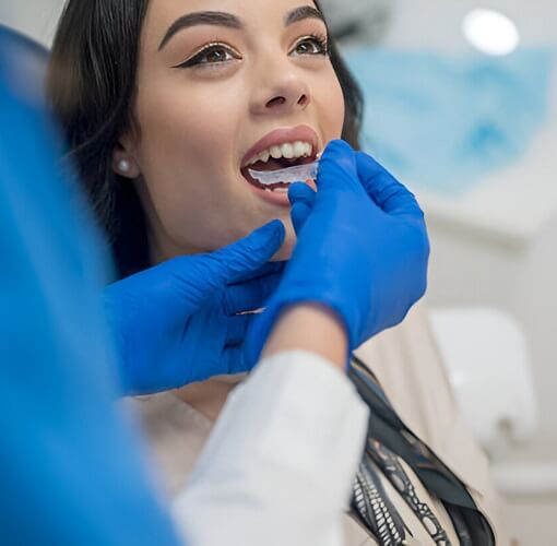 Dentist Inserting Retainer